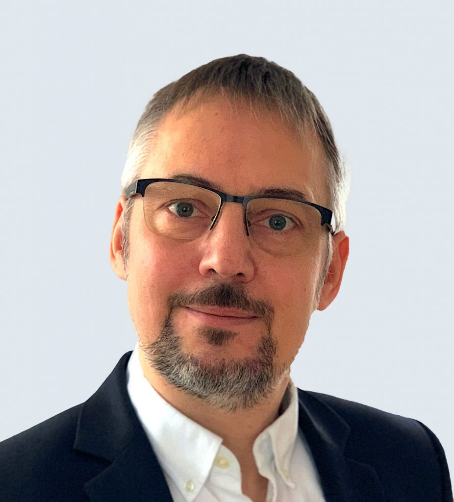 Andreas Seebeck, Leiter IT-Koordination bei Nehlsen GmbH & Co. KG, vor neutralem Hintergrund. Er schätzt die Prozessanalyse und Branchenkenntnisse von tegos.